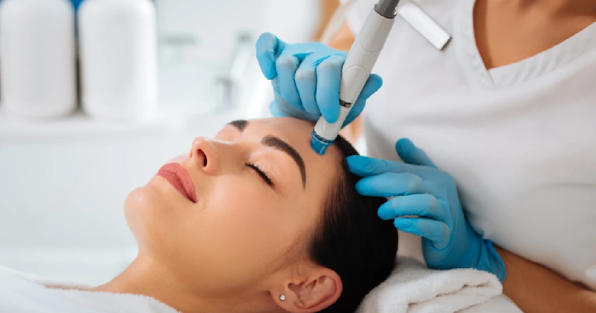A woman receiving a HydraFacial treatment in Aldie, VA