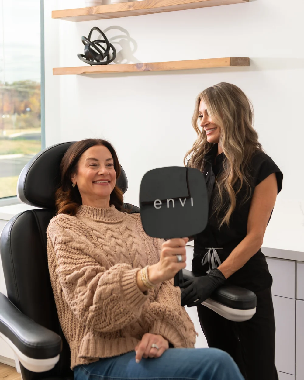 A client admires her results after Botox in Ashburn, VA.